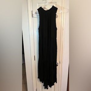 Sleeveless Black Dress with stand up ruffle neckline and high low hem